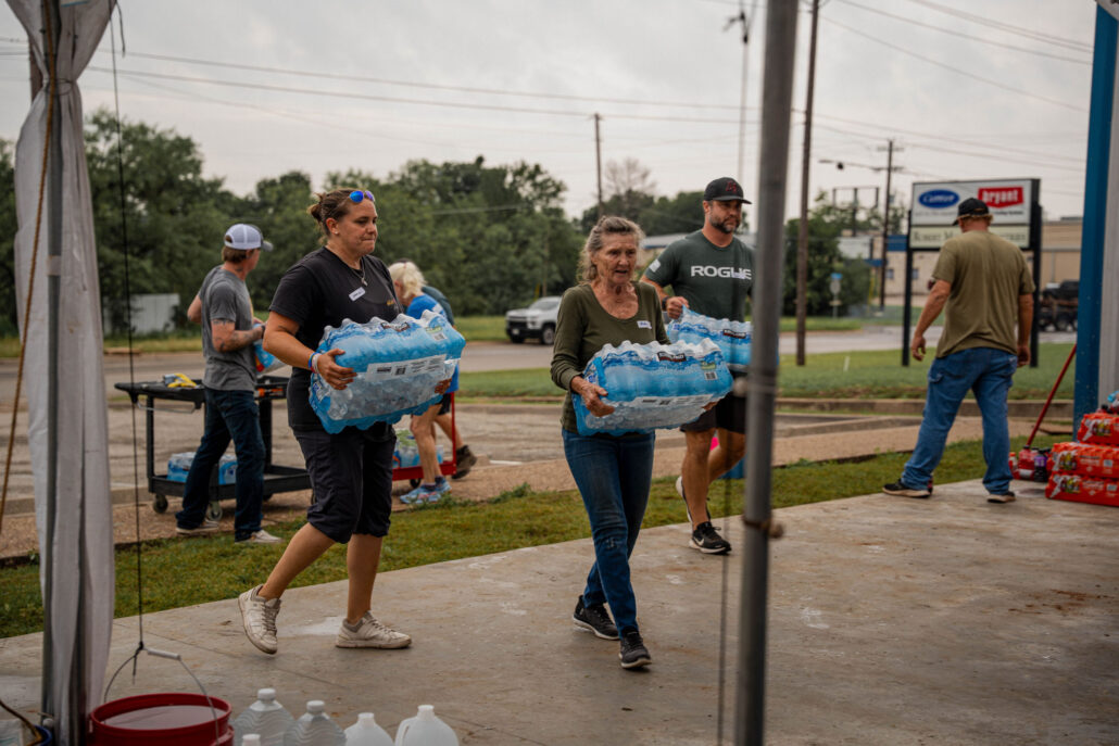 Ark of Highland Lakes Flood Response Volunteers bringing water to the Ark Warehouse to helpl with flood relief