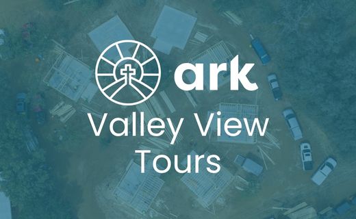 Ark Valley View Tours logo with circular emblem on a blue-green aerial background that reads ’ark Valley View Tours’.