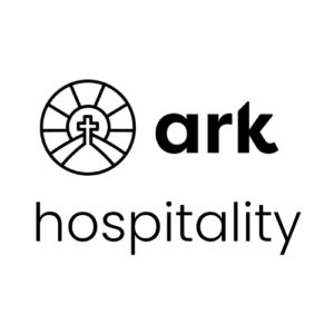 Ark Hospitality logo: a circular emblem with a cross inside a stylized landscape, followed by the bold word 'ark' and the word 'hospitality' beneath.