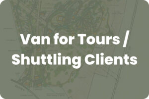 Bold white text over a muted map background: 'Van for Tours / Shuttling Clients' indicating a transportation or service page hero image.